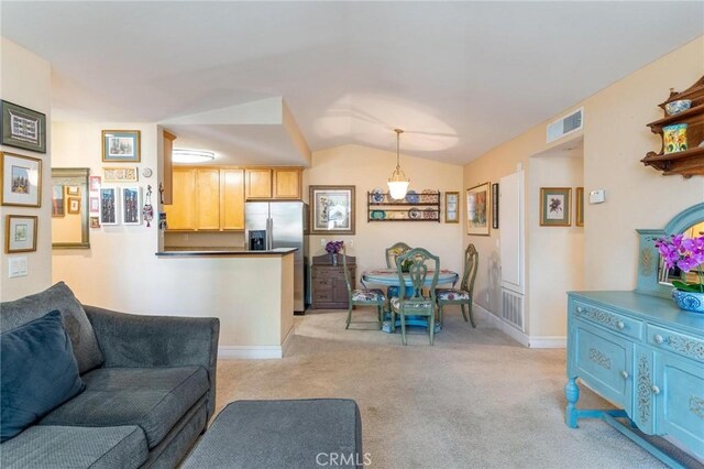 3555 Grove St Unit 231, Lemon Grove, CA 91945 - living room featuring light colored carpet and vaulted ceiling
