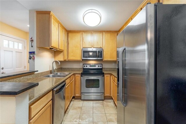 3555 Grove St Unit 231, Lemon Grove, CA 91945 - kitchen with stainless steel appliances, light tile patterned floors, a peninsula, and light brown cabinets