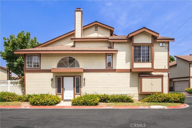 8939 Gallatin Rd Unit 68, Pico Rivera, CA 90660 - view of front of house featuring a chimney