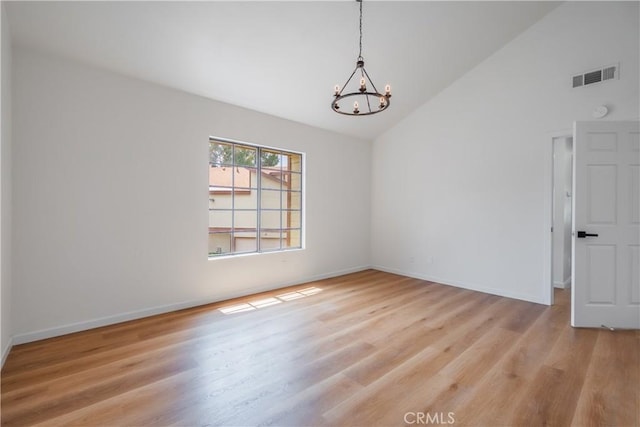 8939 Gallatin Rd Unit 68, Pico Rivera, CA 90660 - empty room with a chandelier, wood finished floors, and high vaulted ceiling