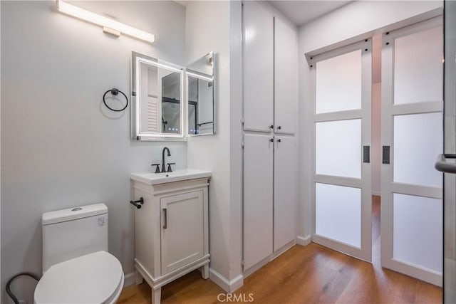 8939 Gallatin Rd Unit 68, Pico Rivera, CA 90660 - bathroom with wood finished floors and vanity