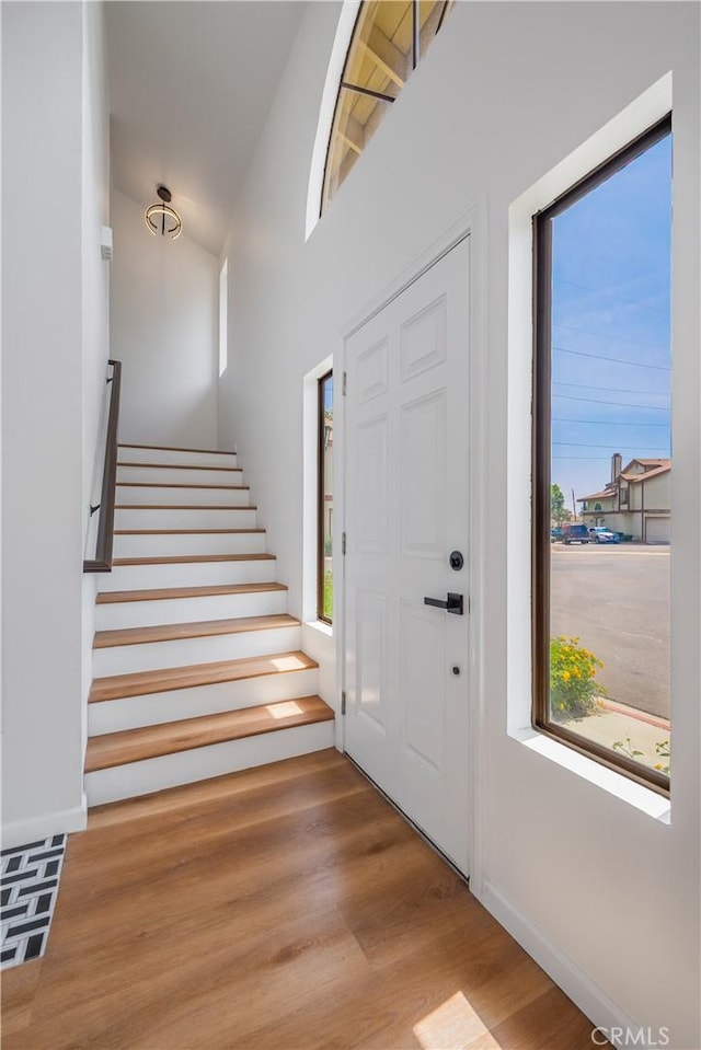 8939 Gallatin Rd Unit 68, Pico Rivera, CA 90660 - entrance foyer with wood finished floors and stairway