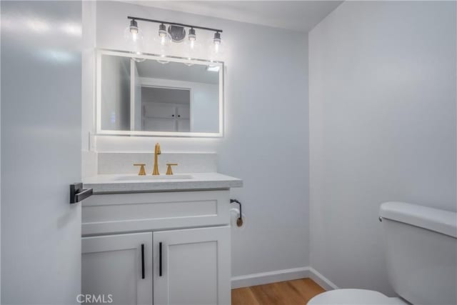 8939 Gallatin Rd Unit 68, Pico Rivera, CA 90660 - half bathroom featuring vanity and wood finished floors
