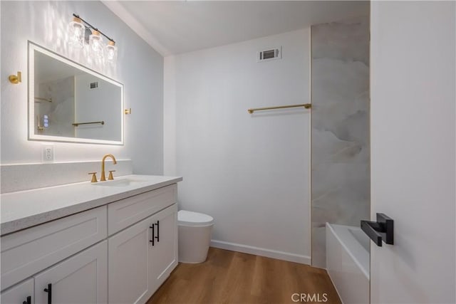8939 Gallatin Rd Unit 68, Pico Rivera, CA 90660 - bathroom featuring vanity, wood finished floors, and bathing tub / shower combination