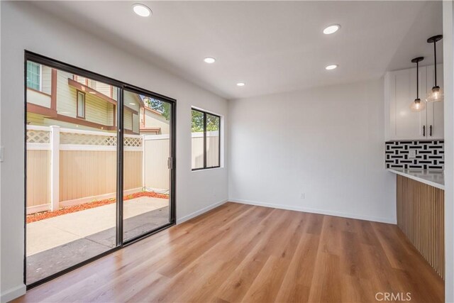 8939 Gallatin Rd Unit 68, Pico Rivera, CA 90660 - empty room with light wood-style flooring and recessed lighting