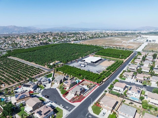 9142 San Luis Obispo Ln, Riverside, CA 92508 - aerial view of residential area featuring property parcel outlined, extensive farmland, and a mountainous background