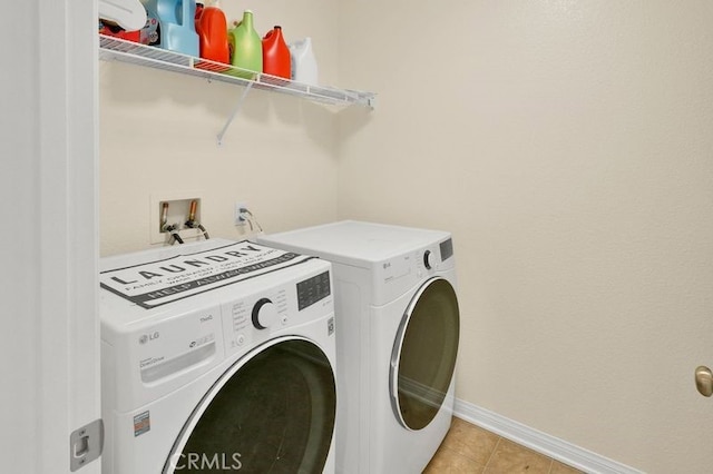 9142 San Luis Obispo Ln, Riverside, CA 92508 - washroom featuring independent washer and dryer and light tile patterned floors