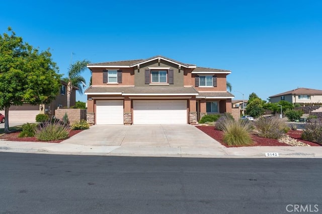 9142 San Luis Obispo Ln, Riverside, CA 92508 - view of front of house featuring stucco siding, a garage, stone siding, and concrete driveway