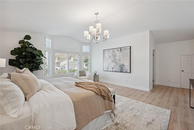 6137 Rustling Oaks Dr, Agoura Hills, CA 91301 - bedroom featuring a chandelier and light wood-style flooring