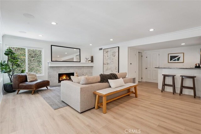 6137 Rustling Oaks Dr, Agoura Hills, CA 91301 - living room featuring crown molding, light wood-style floors, recessed lighting, and a fireplace