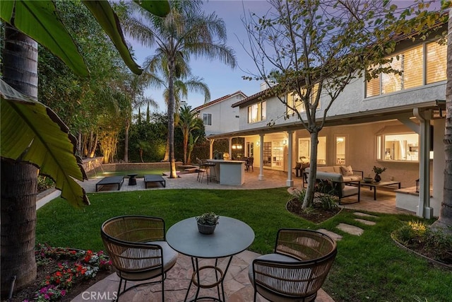 6137 Rustling Oaks Dr, Agoura Hills, CA 91301 - rear view of property with outdoor lounge area, a patio, stucco siding, and a yard