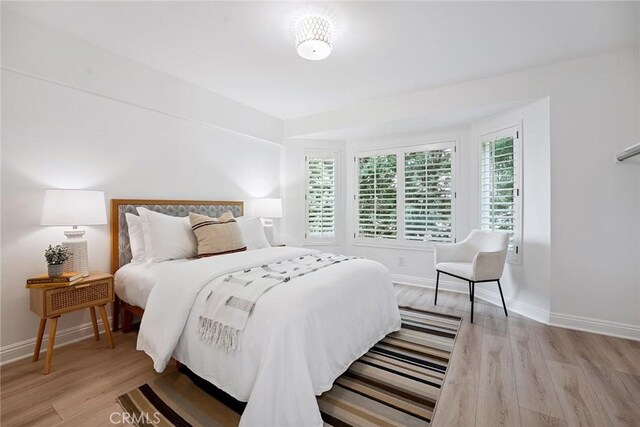 6137 Rustling Oaks Dr, Agoura Hills, CA 91301 - bedroom with wood finished floors and baseboards