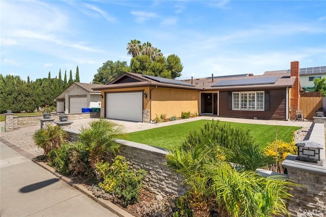 8950 Brentford Ave, San Diego, CA 92126 - ranch-style house featuring driveway, roof mounted solar panels, and an attached garage
