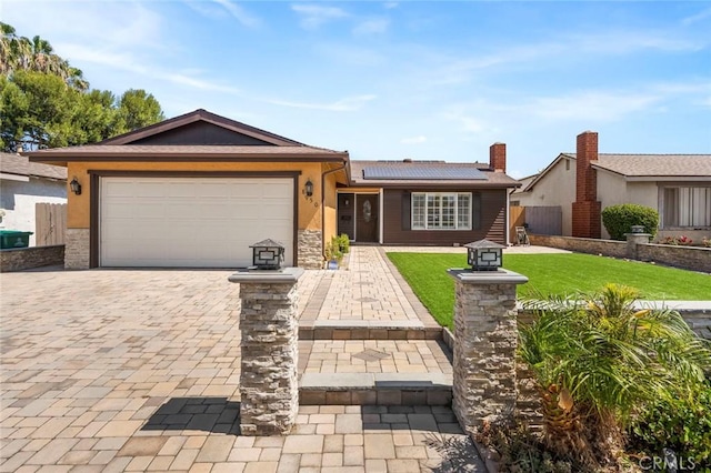 8950 Brentford Ave, San Diego, CA 92126 - single story home featuring roof mounted solar panels, an attached garage, decorative driveway, stucco siding, and stone siding