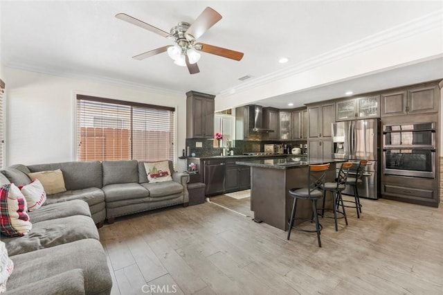 8950 Brentford Ave, San Diego, CA 92126 - living area featuring crown molding, a ceiling fan, light wood-style flooring, and recessed lighting
