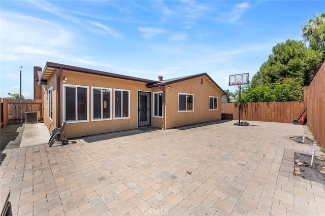 8950 Brentford Ave, San Diego, CA 92126 - back of house with a fenced backyard, stucco siding, and a patio