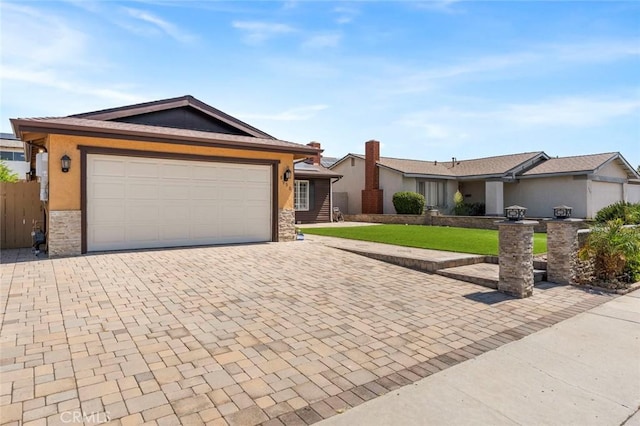 8950 Brentford Ave, San Diego, CA 92126 - single story home featuring decorative driveway, stucco siding, stone siding, a front lawn, and a garage