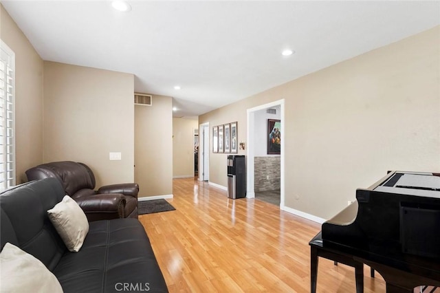 8950 Brentford Ave, San Diego, CA 92126 - living area with light wood-type flooring and recessed lighting