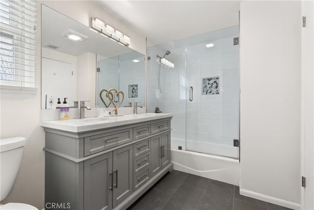 15936 Osborne St, North Hills, CA 91343 - bathroom with double vanity, shower / bath combination with glass door, and tile patterned flooring