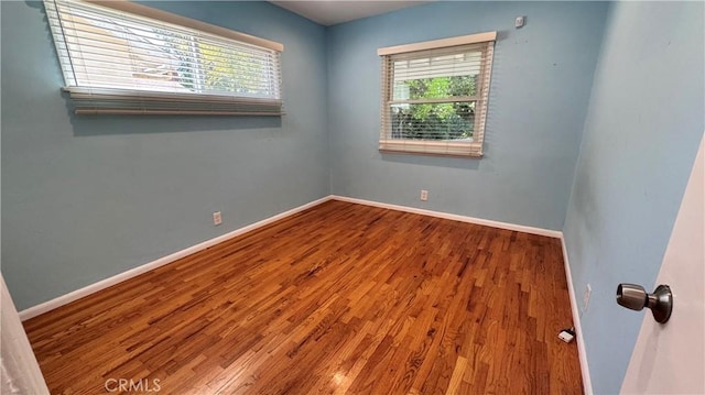 15936 Osborne St, North Hills, CA 91343 - spare room featuring wood finished floors and baseboards