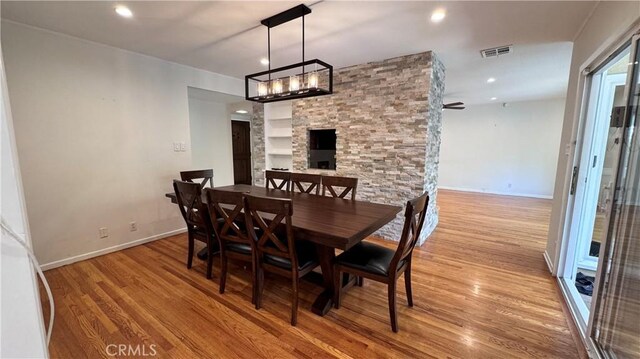 15936 Osborne St, North Hills, CA 91343 - dining area featuring wood finished floors, a chandelier, and recessed lighting