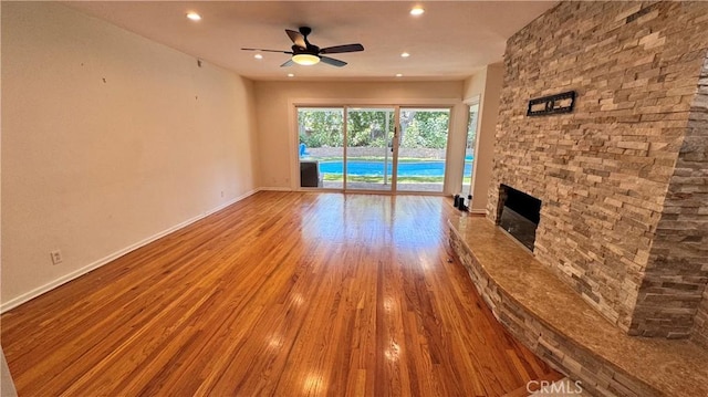 15936 Osborne St, North Hills, CA 91343 - unfurnished living room featuring ceiling fan, wood finished floors, recessed lighting, and a fireplace