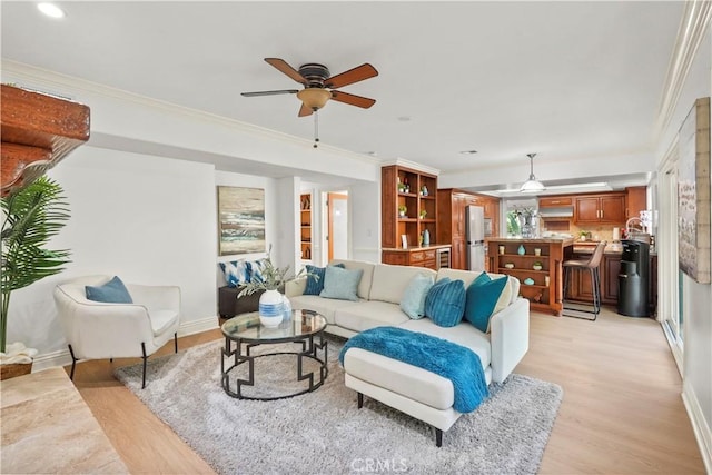 22550 Flamingo St, Woodland Hills, CA 91364 - living area featuring a ceiling fan, light wood-style flooring, and crown molding