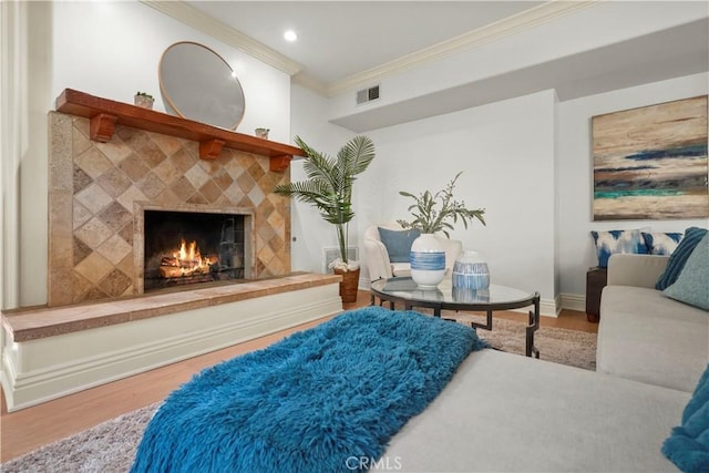 22550 Flamingo St, Woodland Hills, CA 91364 - bedroom featuring crown molding, wood finished floors, a tiled fireplace, and recessed lighting