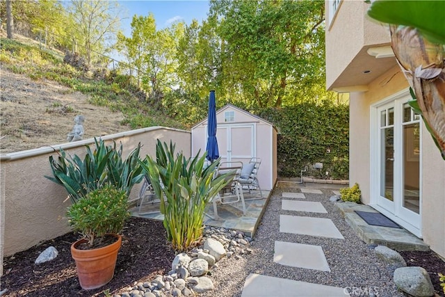 22550 Flamingo St, Woodland Hills, CA 91364 - view of yard with a storage unit and a patio