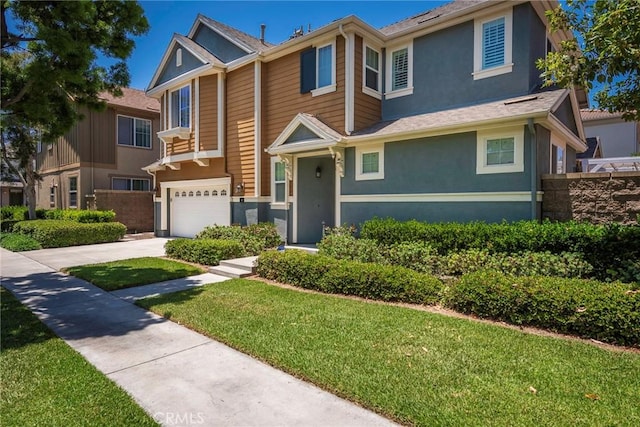 72 Westwind Dr, Tustin, CA 92782 - view of front of house with a garage, stucco siding, and driveway