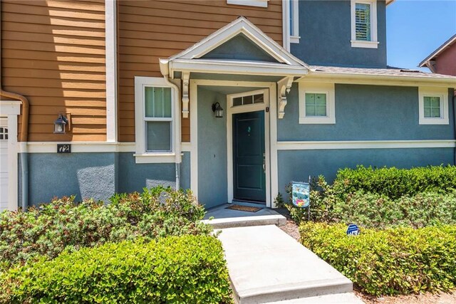 72 Westwind Dr, Tustin, CA 92782 - view of exterior entry with stucco siding