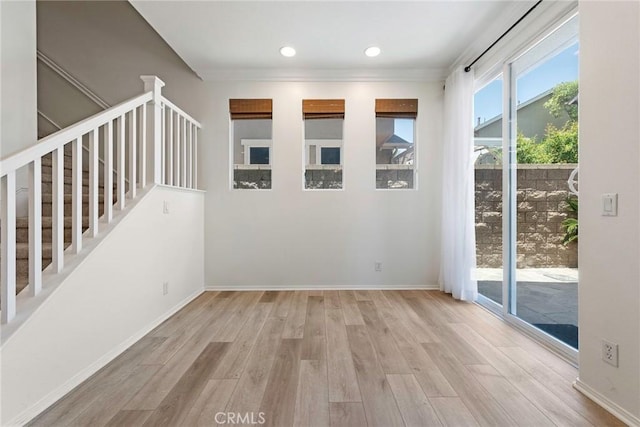 72 Westwind Dr, Tustin, CA 92782 - spare room with wood finished floors, recessed lighting, stairs, and ornamental molding