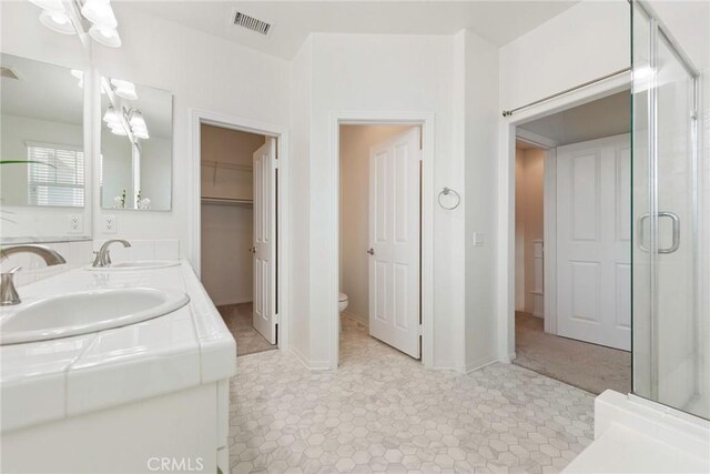 72 Westwind Dr, Tustin, CA 92782 - full bathroom with double vanity, a shower stall, and a closet