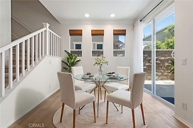 72 Westwind Dr, Tustin, CA 92782 - dining area with wood finished floors, crown molding, recessed lighting, and stairway