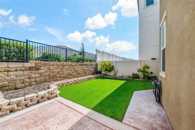 3908 Boulder Dr, Jurupa Valley, CA 92509 - fenced backyard with a patio