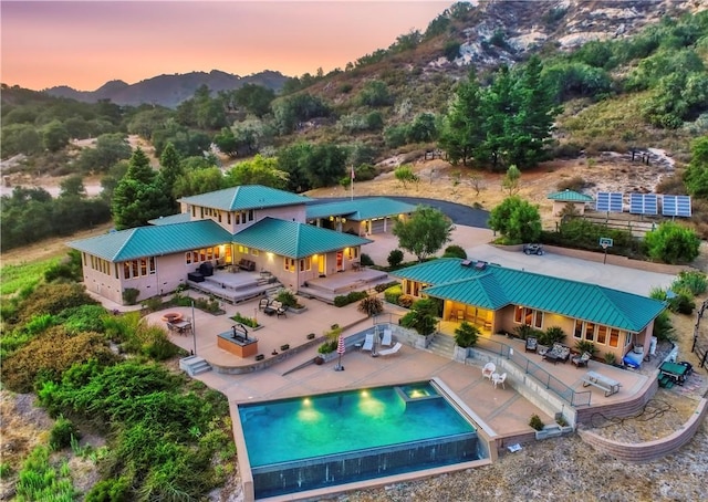 4570 Christine Loomis Dr, Arroyo Grande, CA 93420 - pool at dusk with a patio area and a deck with mountain view