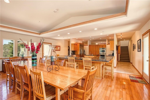 4570 Christine Loomis Dr, Arroyo Grande, CA 93420 - dining room featuring lofted ceiling, light wood-style flooring, and stairs