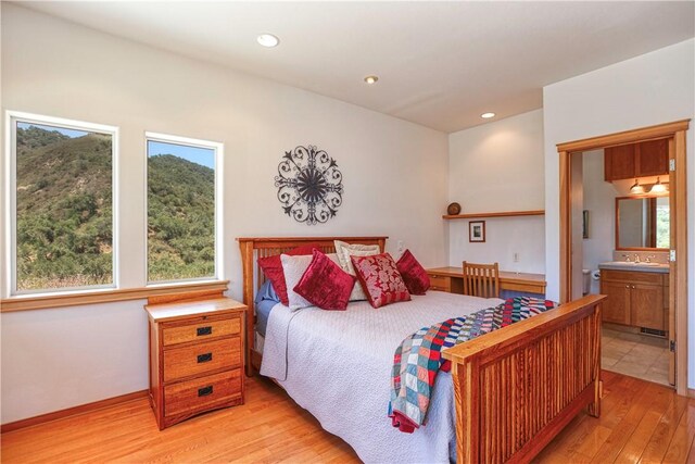 4570 Christine Loomis Dr, Arroyo Grande, CA 93420 - bedroom with light wood-style floors, recessed lighting, and connected bathroom
