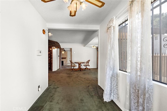 9649 Grace St, Fontana, CA 92335 - hallway with carpet floors and a textured ceiling