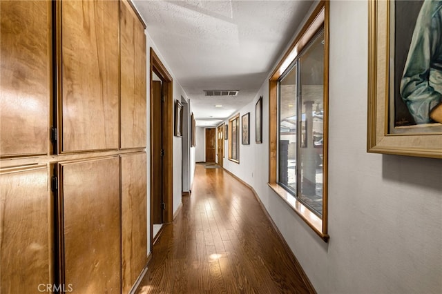 1146 Sandhurst Ln, La Verne, CA 91750 - hallway featuring hardwood / wood-style floors and a textured ceiling