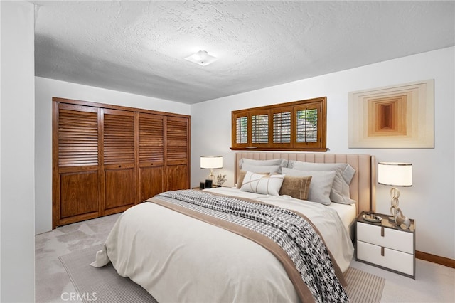 1146 Sandhurst Ln, La Verne, CA 91750 - bedroom with light carpet, a closet, and a textured ceiling