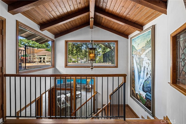 1146 Sandhurst Ln, La Verne, CA 91750 - hallway with an upstairs landing, a chandelier, wood finished floors, and wood ceiling