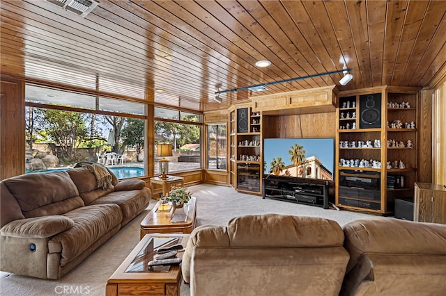 1146 Sandhurst Ln, La Verne, CA 91750 - living room featuring carpet floors, wood ceiling, wooden walls, and built in shelves