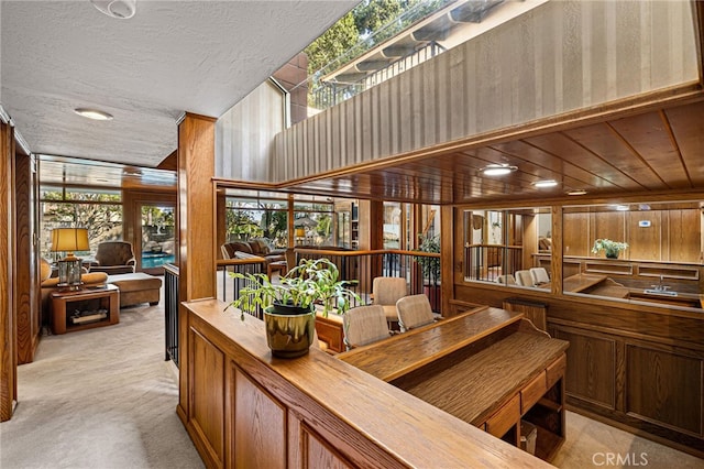 1146 Sandhurst Ln, La Verne, CA 91750 - interior space with light carpet, wood walls, and a textured ceiling