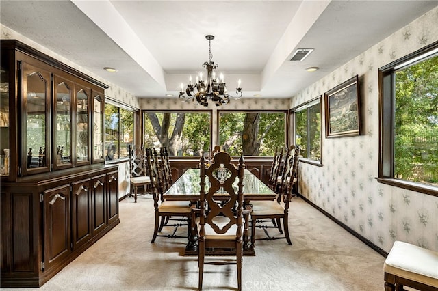 1146 Sandhurst Ln, La Verne, CA 91750 - dining space with wallpapered walls, a chandelier, and light colored carpet