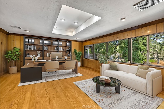 1146 Sandhurst Ln, La Verne, CA 91750 - office featuring light wood-style flooring, wooden walls, and a textured ceiling