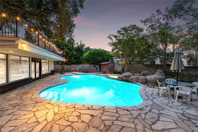 1146 Sandhurst Ln, La Verne, CA 91750 - view of swimming pool featuring a patio area, a fenced backyard, and a storage unit