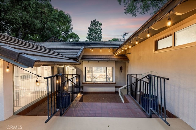 1146 Sandhurst Ln, La Verne, CA 91750 - exterior entry at dusk featuring stucco siding
