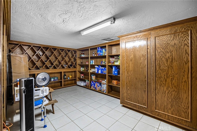 1146 Sandhurst Ln, La Verne, CA 91750 - wine room featuring light tile patterned flooring and a textured ceiling