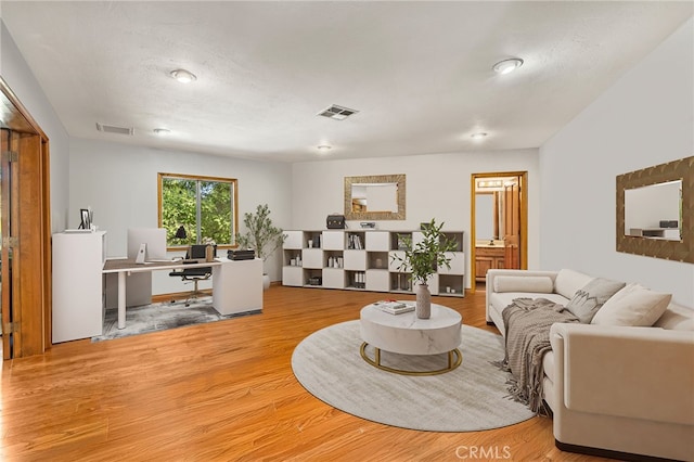 1146 Sandhurst Ln, La Verne, CA 91750 - living area with a desk and light wood-style flooring